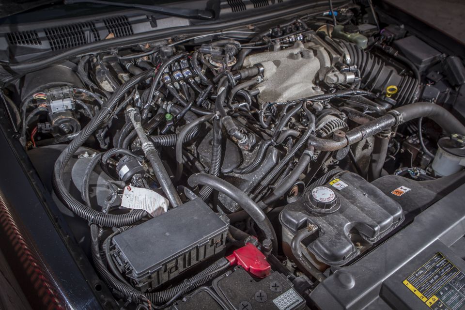 Engine bay of a 2003 Mercury Marauder with visible aftermarket modifications.