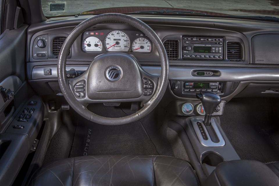 Interior of a 2003 Mercury Marauder dashboard, steering wheel, and center console.