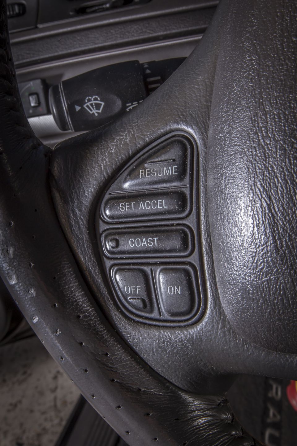 Steering wheel cruise control buttons: RESUME, SET ACCEL, COAST, OFF, ON.