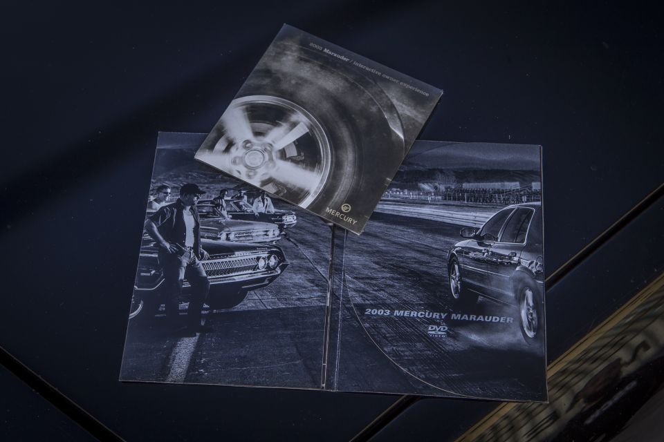 2003 Mercury Marauder DVD brochure with black and white drag strip photos