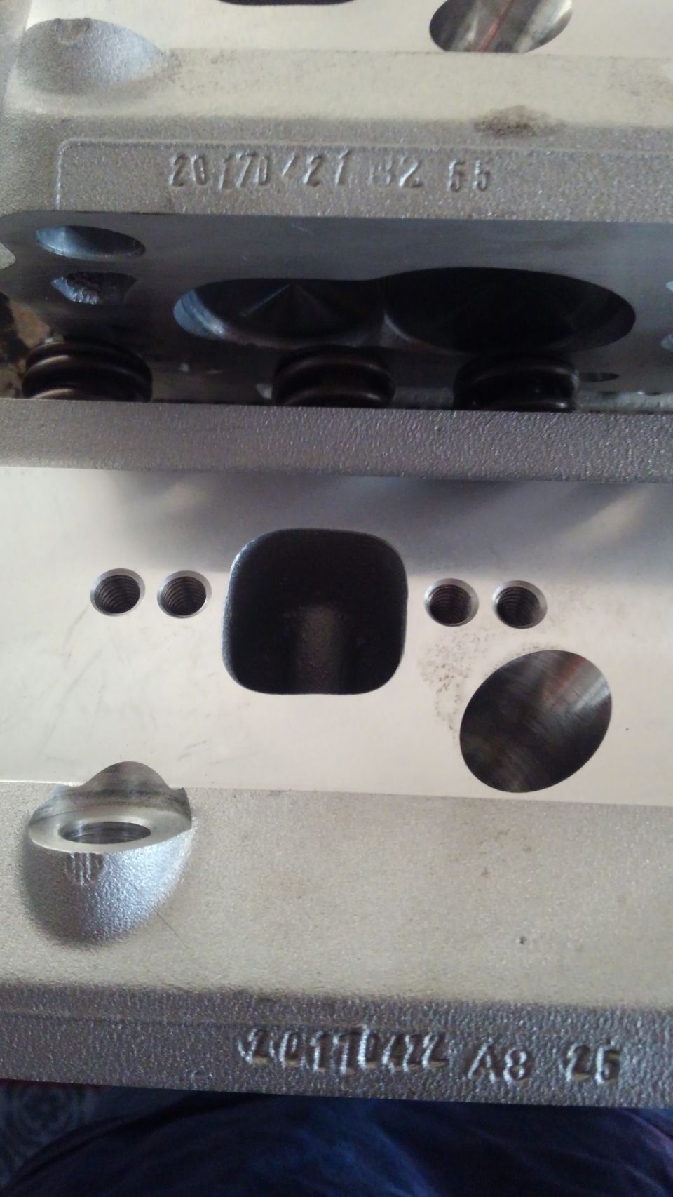 these are the only markings on the heads. seems to be the date of manufacture and another code of sorts.
20170421 B2 55
20170422 A8 25
im assuming they refer to 04/21/2017 and 04/22/2017 but im not sure what the other two stand for

the heads come with 2 sizes of header bolt patterns. i dont think the ProComp or Speedmasters heads have the 2 different sizes. the Procomp heads also have a different chamber size but the Speedmasters are same chamber size. Speedmasters cylinder heads are however alot more costly and have alot more markings in them