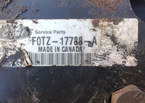 1994 Ford Bronco - A close-up of a Ford service parts label that reads "FOTZ-17788-A MADE IN CANADA" and shows a partial Ford logo. The label is attached to a…