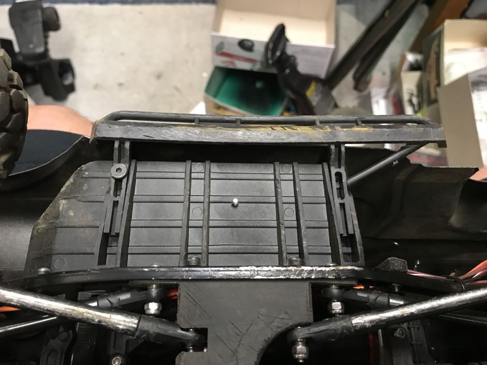 RC car chassis detail with roof rack and suspension components