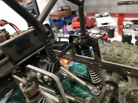 1989 Ford Bronco - Close-up view of a model car's chassis and suspension system.