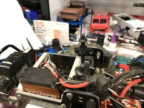 1989 Ford Bronco - Close-up view of an RC car's chassis, showing the Savox servo and various electronic components.