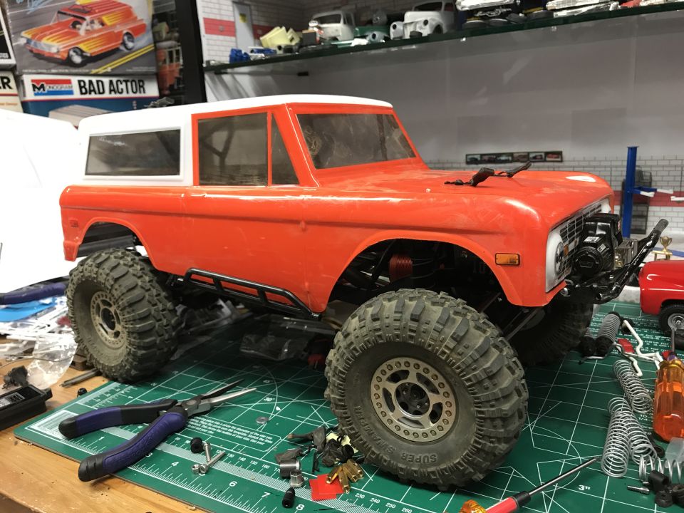RC rock crawler Bronco body on a workbench with tools
