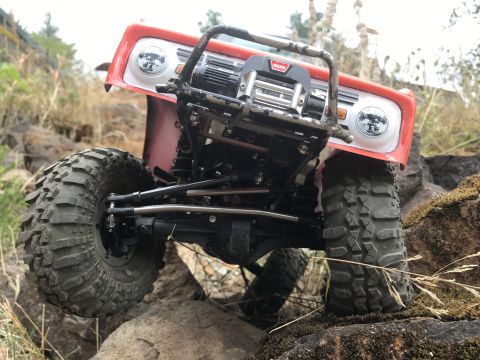 1989 Ford Bronco - RC rock crawler truck, front view, modified with a winch and off-road tires. Resembles a 1966 Ford Bronco.