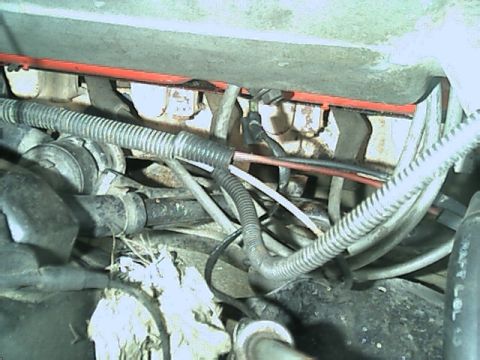 1989 Ford Bronco - Engine bay wiring and hoses are visible in this close-up view.