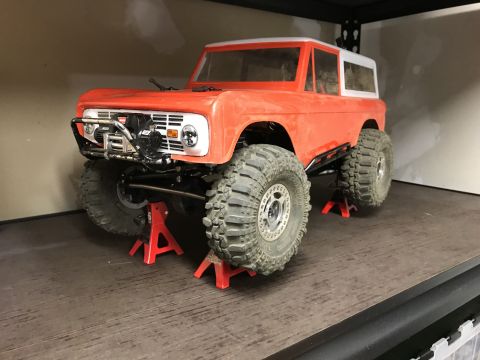 1989 Ford Bronco - RC model of a classic Ford Bronco, likely a 1966 model, displayed on jack stands.
