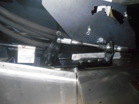 1992 Ford Bronco - A close-up view of a mechanical linkage system, likely part of a vehicle's drivetrain or control system.
