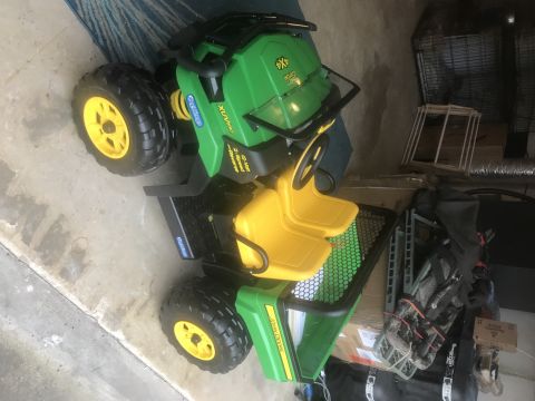 1974 Ford Bronco - This toy vehicle has "John Deere" branding and "XUV 590i" markings.