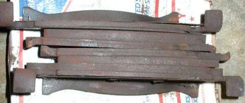 1992 Ford Bronco - Worn brake pads with part number "NACO 405 FE-178-13-S" visible.