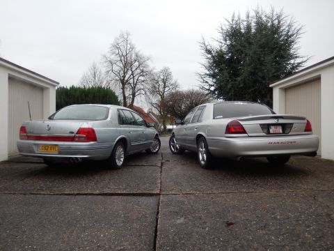 1999 Ford Fairlane - A 2003 Mercury Marauder and another sedan are parked side-by-side in a driveway.