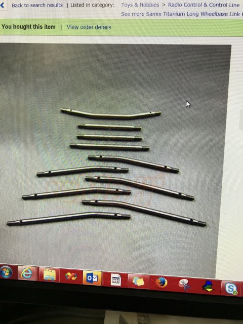 1989 Ford Bronco - Several metal rods of varying lengths and curves are laid out on a flat surface.