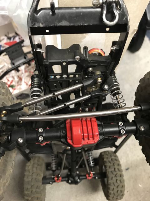 1989 Ford Bronco - Close-up view of the undercarriage and suspension components of a remote-controlled rock crawler.