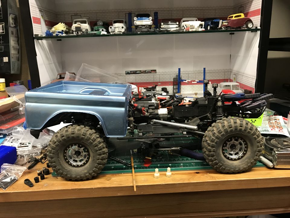 RC model truck chassis with light blue pickup body, side view