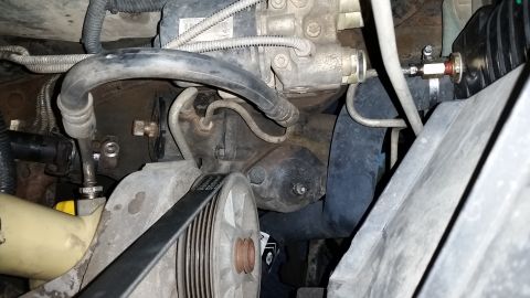 1996 Ford Bronco - I started removing the old 2-bolt steering gear by disconnecting the power steering lines, and disconnecting the steering shaft. In the fut…