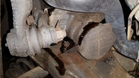 1996 Ford Bronco - View from underneath the truck. The 2-bolt steering gear is still in place, and the suspension components are still attached.