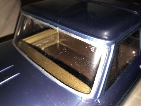 1989 Ford Bronco - Detail shot of a model truck's cab, focusing on the windshield and interior.