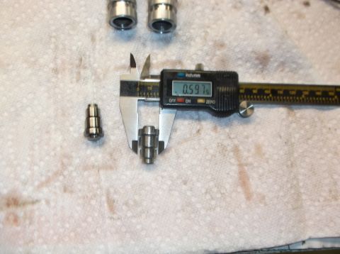 1979 Ford Ranchero - A digital caliper is used to measure the diameter of a valve lifter, showing a reading of 0.597 inches.