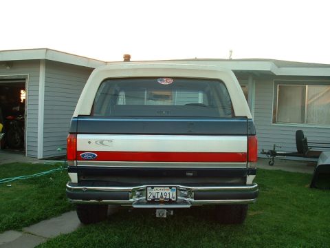 1990 Ford Bronco - Rear view of a 1990 Ford Bronco parked in a driveway.