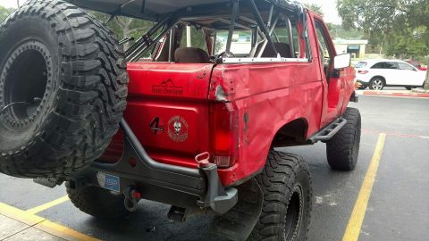1989 Ford Bronco - This modified 1989 Ford Bronco features an external roll cage and large off-road tires.