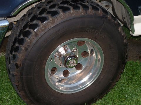 1990 Ford Bronco - Close-up of a wheel and tire, likely from an SUV or truck.