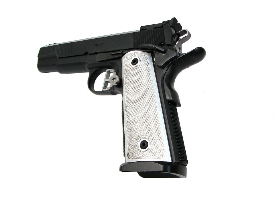 Black 1911-style semi-automatic pistol with chrome checkered grips on white background