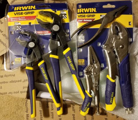 2000 Ford Crown Victoria - A collection of Irwin Vise-Grip tools, such as groove lock pliers and fast release locking pliers, are displayed in their packaging.