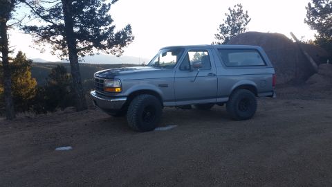 1995 Ford Bronco - This 1995 Ford Bronco is captured in a scenic outdoor setting, its design.