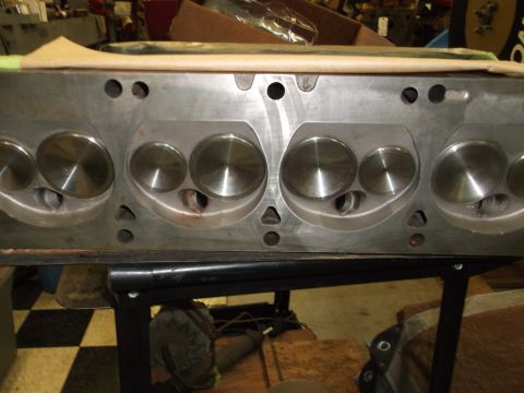 1964 Ford Galaxie - Close-up of an engine cylinder head, showing intake and exhaust valves and combustion chambers.