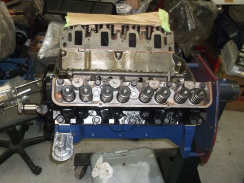 1964 Ford Galaxie - Engine block and cylinder heads disassembled on a stand, ready for rebuild or inspection.