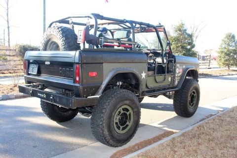 1972 Ford Bronco - This heavily modified Ford Bronco features a custom roll cage and off-road tires, suggesting it's built for terrain.