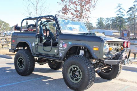 1972 Ford Bronco - This modified 1972 Ford Bronco features an olive green paint job and extensive off-road enhancements.