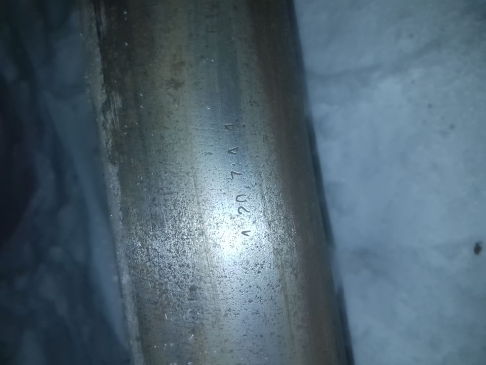 Metal axle part with stamped numbers '1 20 7 4 A'