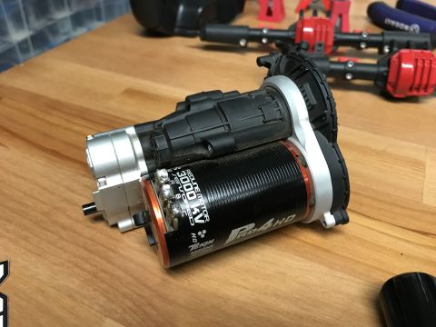 1989 Ford Bronco - Close-up of a Tekin RG4 HD 3000KV electric motor and gearbox assembly for an RC car.
