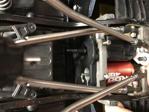 1989 Ford Bronco - Detail of a remote control car's internal mechanics, including the motor and drive train.