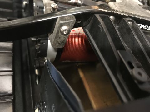 1989 Ford Bronco - Detail of internal mechanical components, including a red ribbed coil.