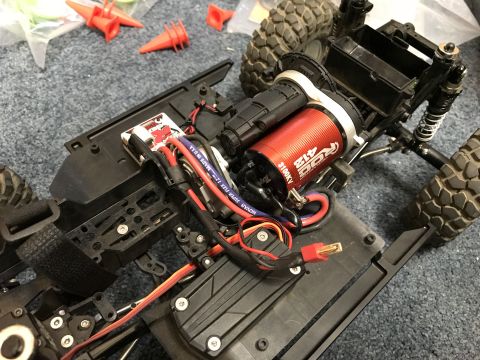 1989 Ford Bronco - Close-up view of the internal components and chassis of a remote-controlled car.