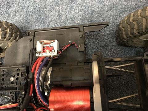 1989 Ford Bronco - Close-up of an RC car's internal components, including the speed controller and motor.