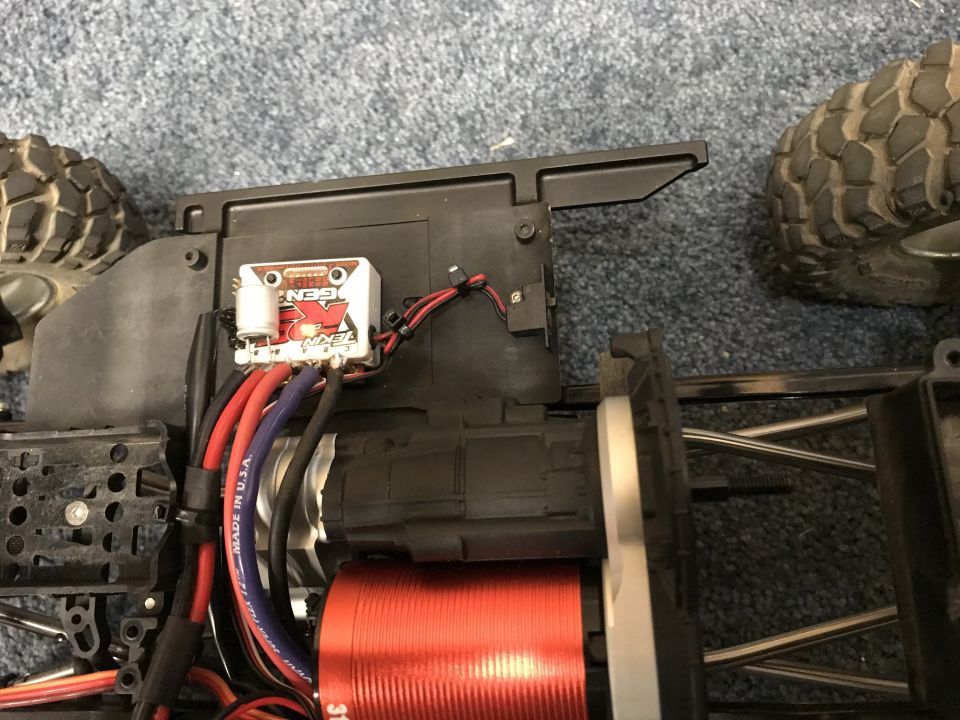 RC car electronic speed controller and red motor with wires