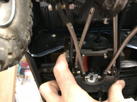 1989 Ford Bronco - Close-up view of the underside of a toy vehicle, showing suspension and drivetrain details.