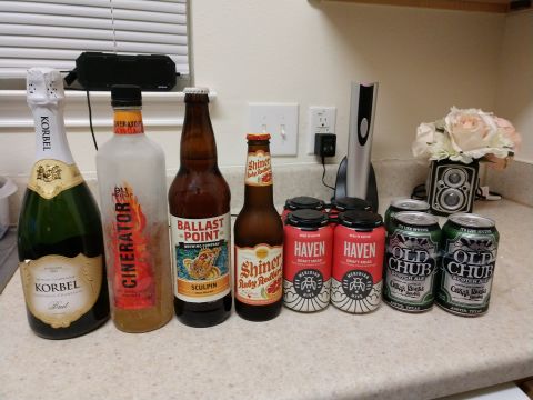 1989 Ford Bronco - A collection of various alcoholic beverages is arranged on a countertop.
