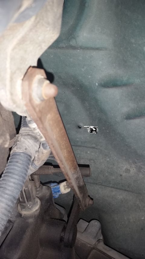 1996 Ford Bronco - Looking up from underneath the truck, on the driver's side we can see that Ford has already punched a hole in the body in order to mount th…