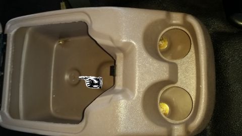 1996 Ford Bronco - After creating and expanding the first two holes, I mounted the center console using the first two screws only. Once screwed down, I used t…