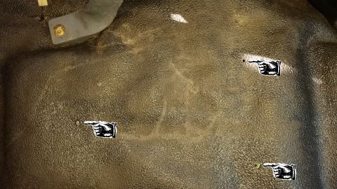 1996 Ford Bronco - After marking the location of the third mounting hole, I removed the center console again so that I could expand the hole slightly, and to…