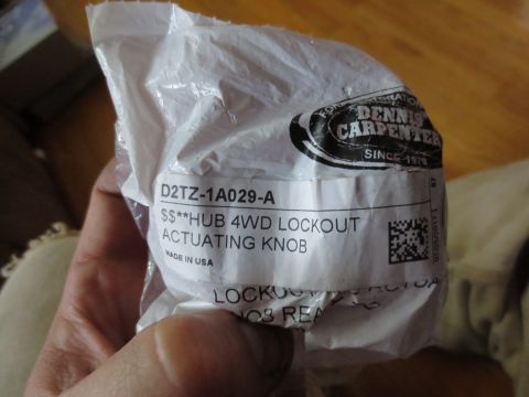 1967 Ford F-250 - A part for a vehicle, a 4WD lockout actuating knob, is shown in its original packaging.