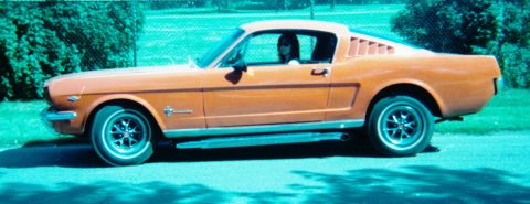 1996 Ford Bronco - Orange 1965 Ford Mustang Fastback with louvers on the rear quarter panel.