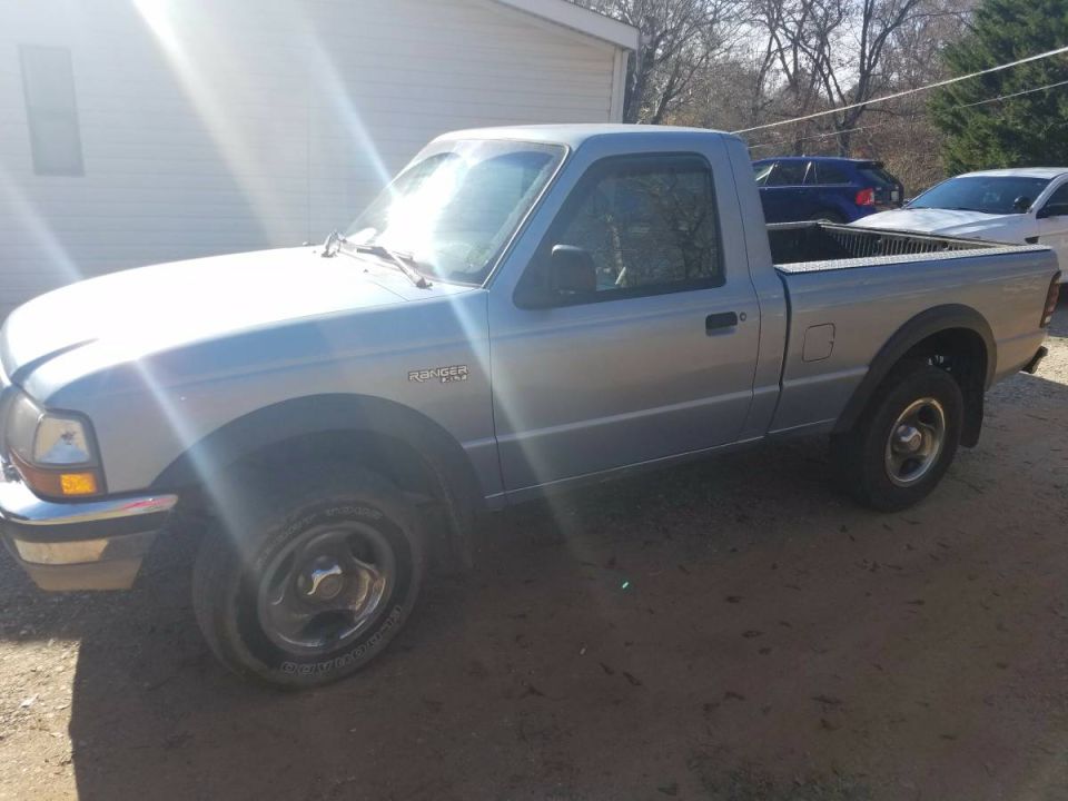 Silver 1998 Ford Ranger pickup truck, 3/4 front view