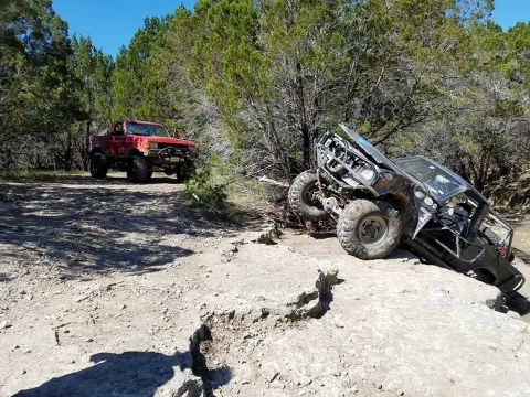 1989 Ford Bronco - My buddy Jay sorta flipped his toy over and it caught fire. winched him up with the smittybilt.